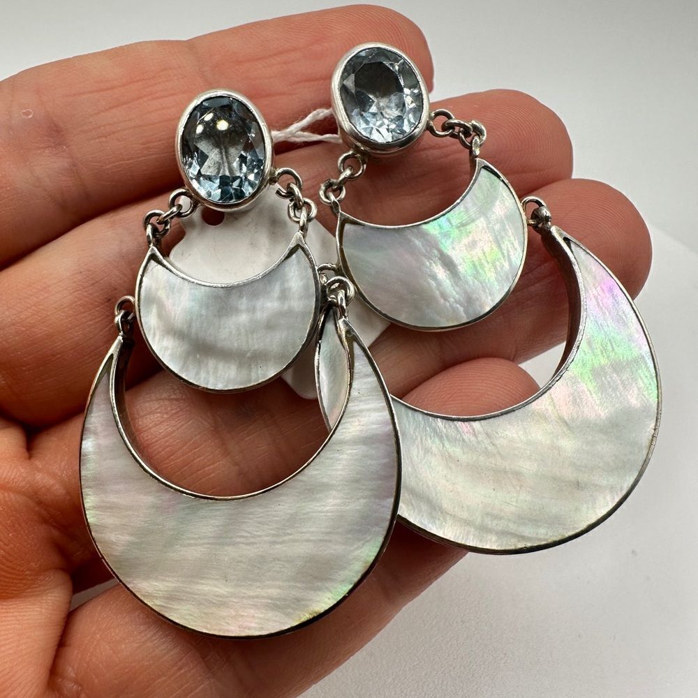 Genuine blue topaz and mother of Pearl in .925 dangle earrings!